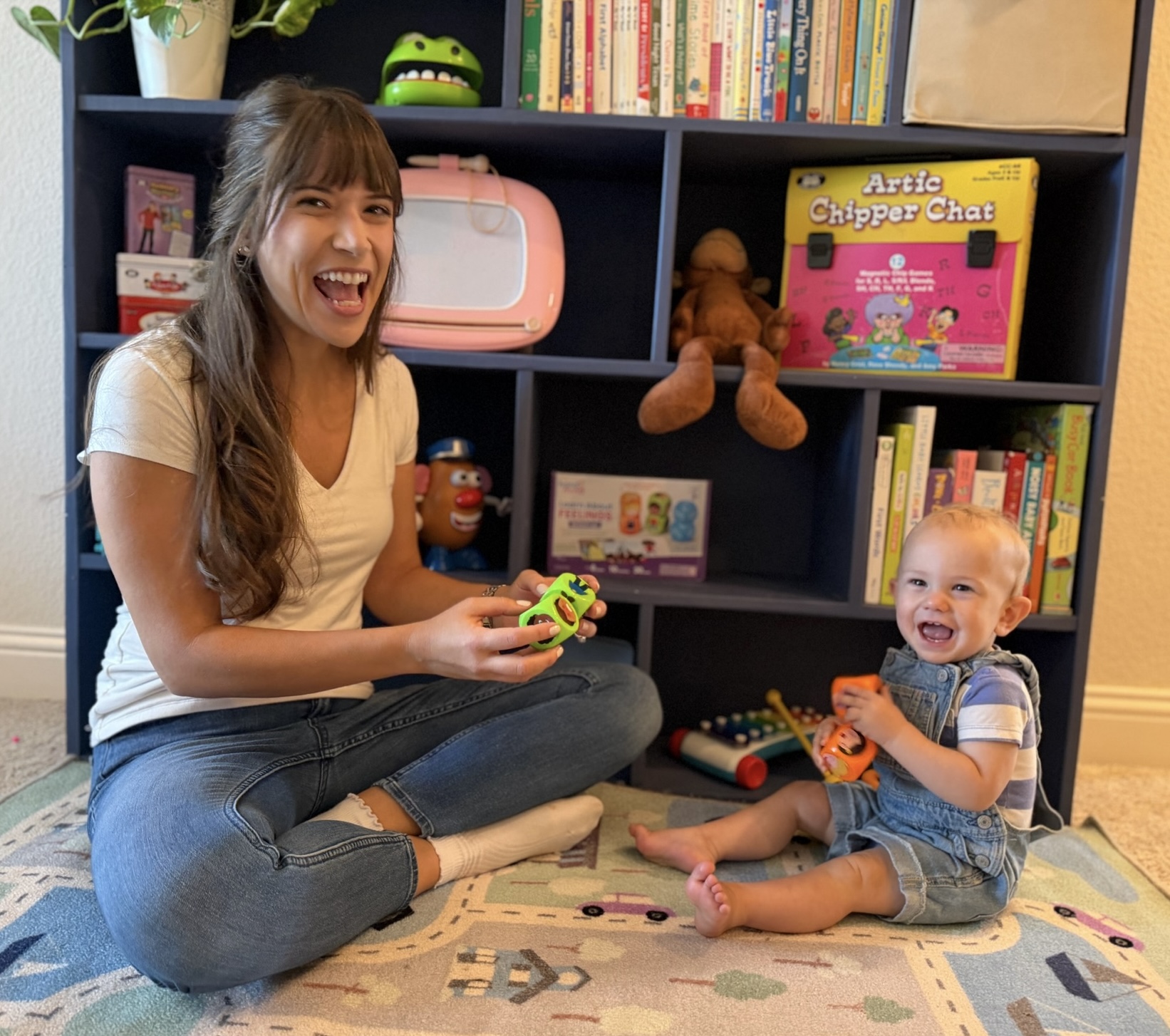 Sarah playing with a toddler